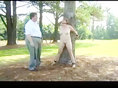 Woman bound to tree for light servitude