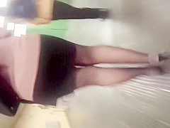 Curvy blond honey in a small dark miniskirt is stalked in t