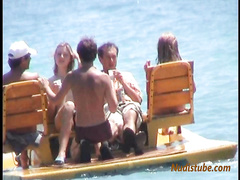 Nudist youth having fun with friends