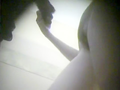Hot sweetheart with a hirsute cookie is filmed changing garments in