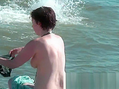 Sweatie tanned love tunnel at nudist beach