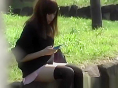 Oriental legal age teenager honey secretly filmed upskirt outdoors in public