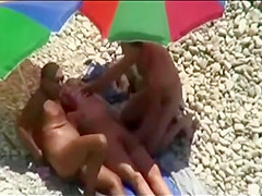 Three-Some sex joy on public beach caught on voyeur web camera