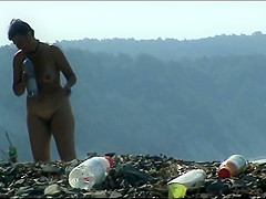 Aged woman with a large arse on a nudist beach