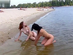 2 NUDIST BEACH TEENIES ON SAND AND IN SEA